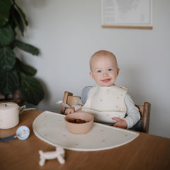 Mushie placemat measures 18 by 8.87 inches for a comfortable mealtime fit.