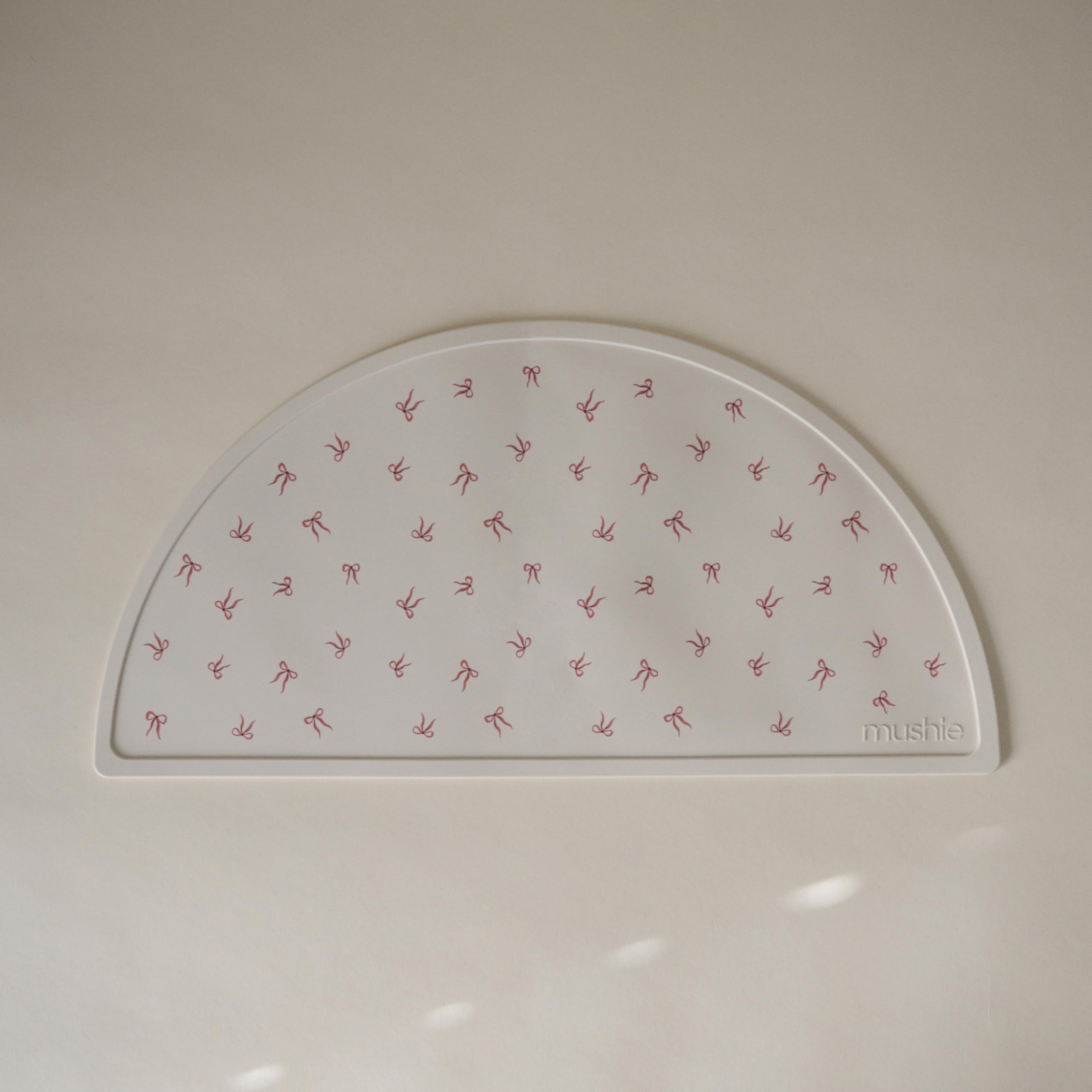 Mushie silicone placemat non-slip base keeps place mats from slipping.