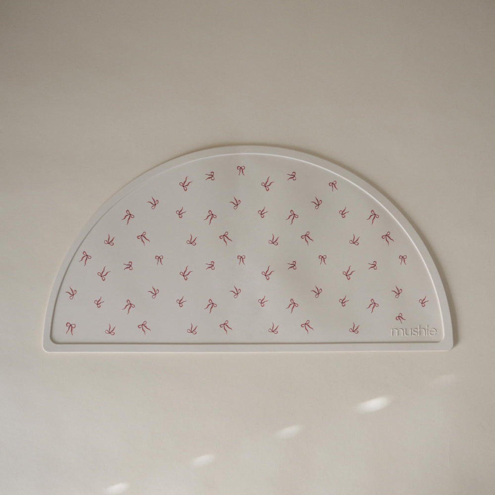 Mushie silicone placemat non-slip base keeps place mats from slipping.