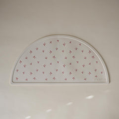 Mushie silicone placemat non-slip base keeps place mats from slipping.
