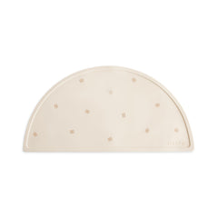 Mushie silicone placemat with pretzel pattern supports mess-free mealtimes for little diners.