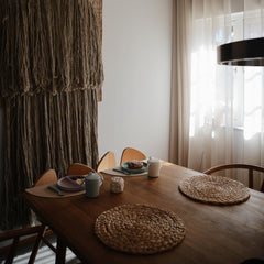 Mushie silicone placemat Shifting Sand colors-on-table shows versatile color pairing with dishes.