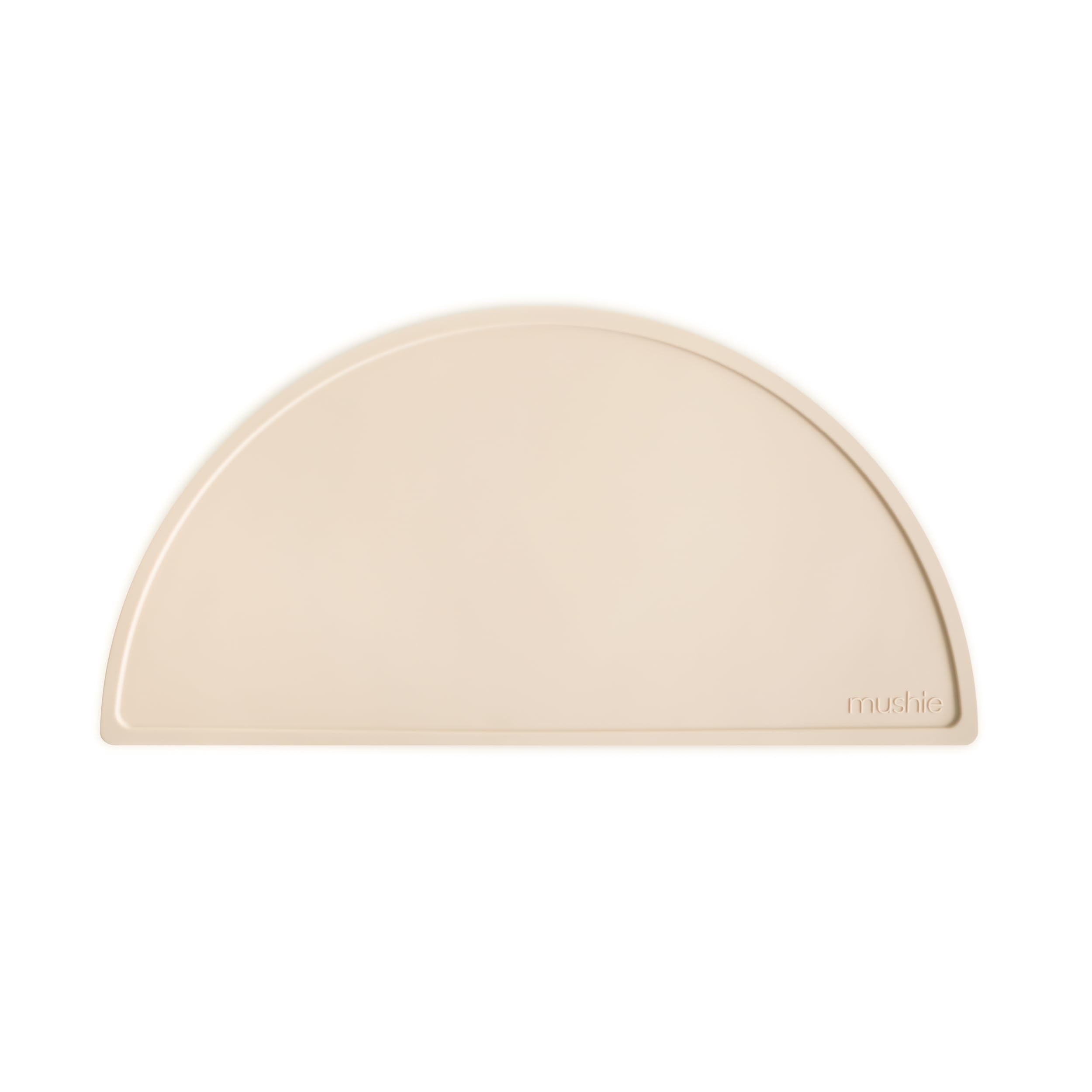 Mushie silicone placemat Shifting Sand tabletop hero shows non-slip base for tidy mealtimes.