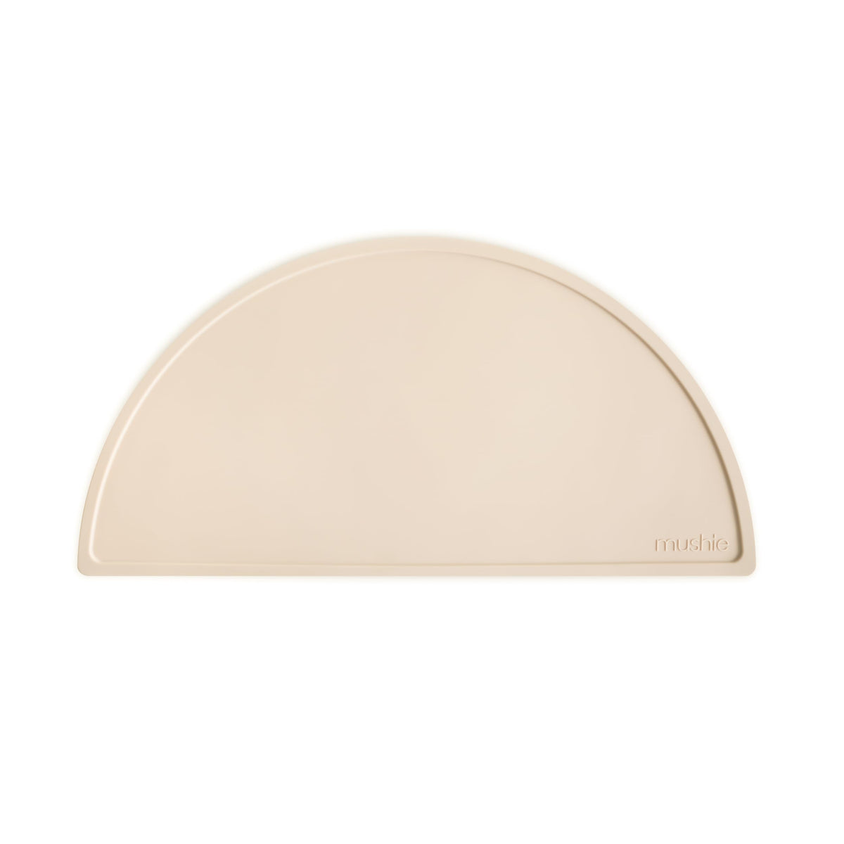 Mushie silicone placemat Shifting Sand tabletop hero shows non-slip base for tidy mealtimes.
