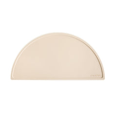Mushie silicone placemat Shifting Sand tabletop hero shows non-slip base for tidy mealtimes.