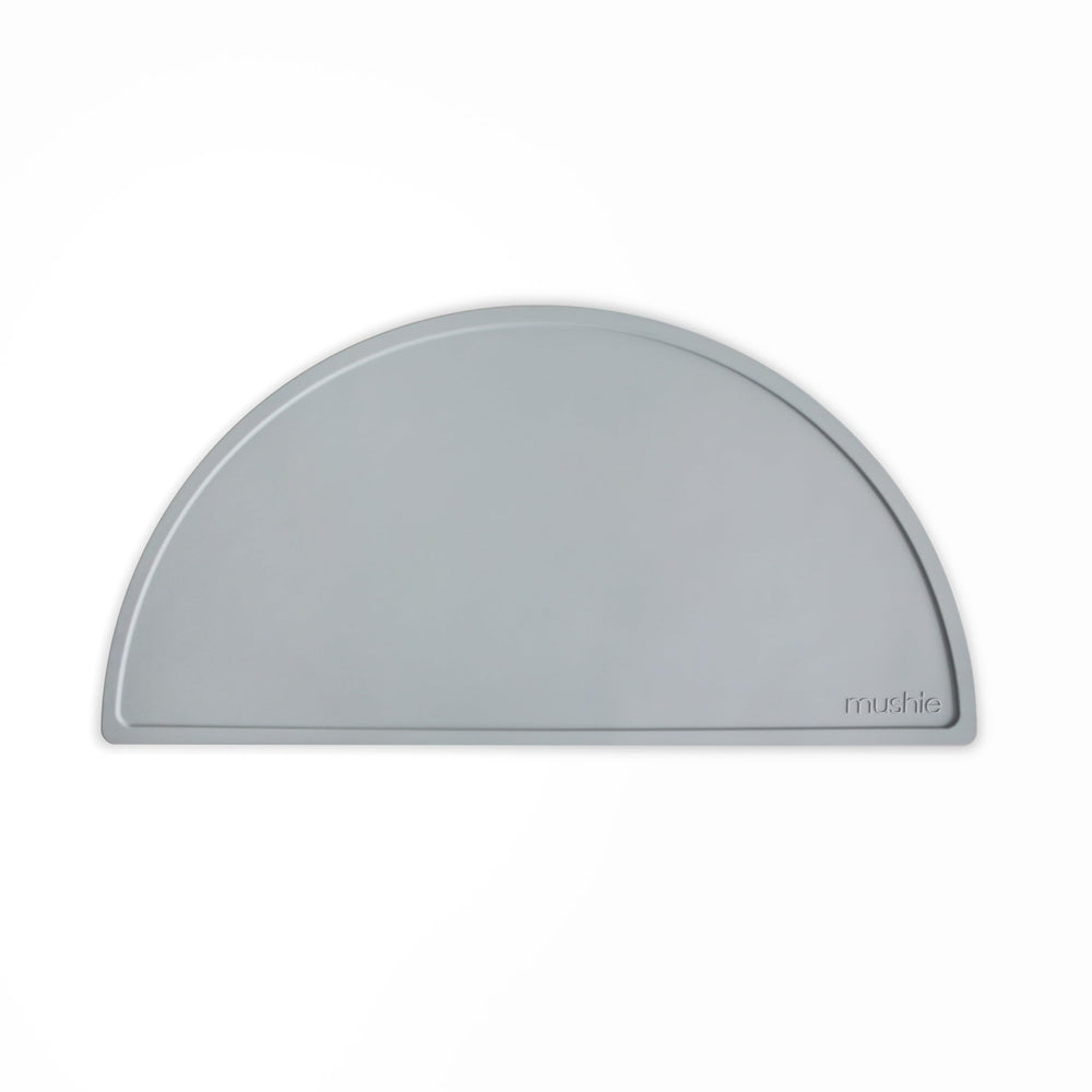 Mushie silicone placemat stone angle showcases non-slip surface for mess-free mealtimes.