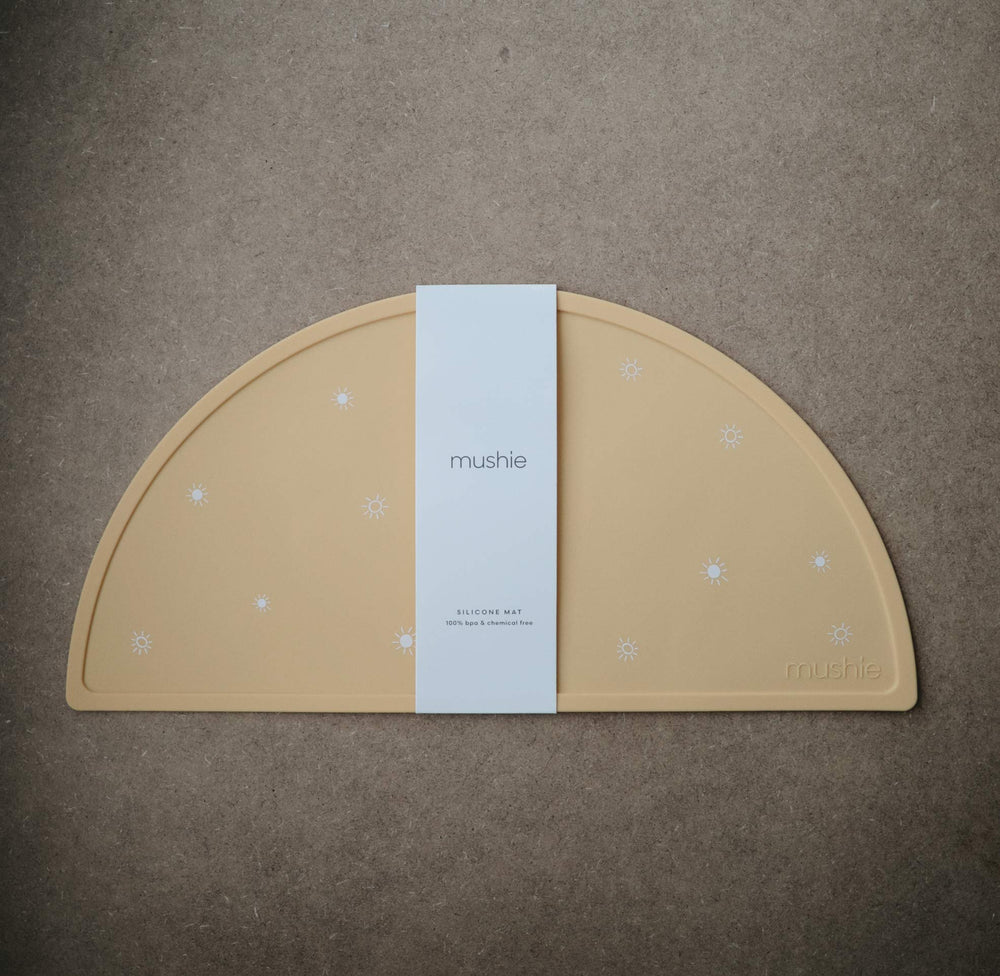 Mushie placemat edge close-up showing soft silicone edge
