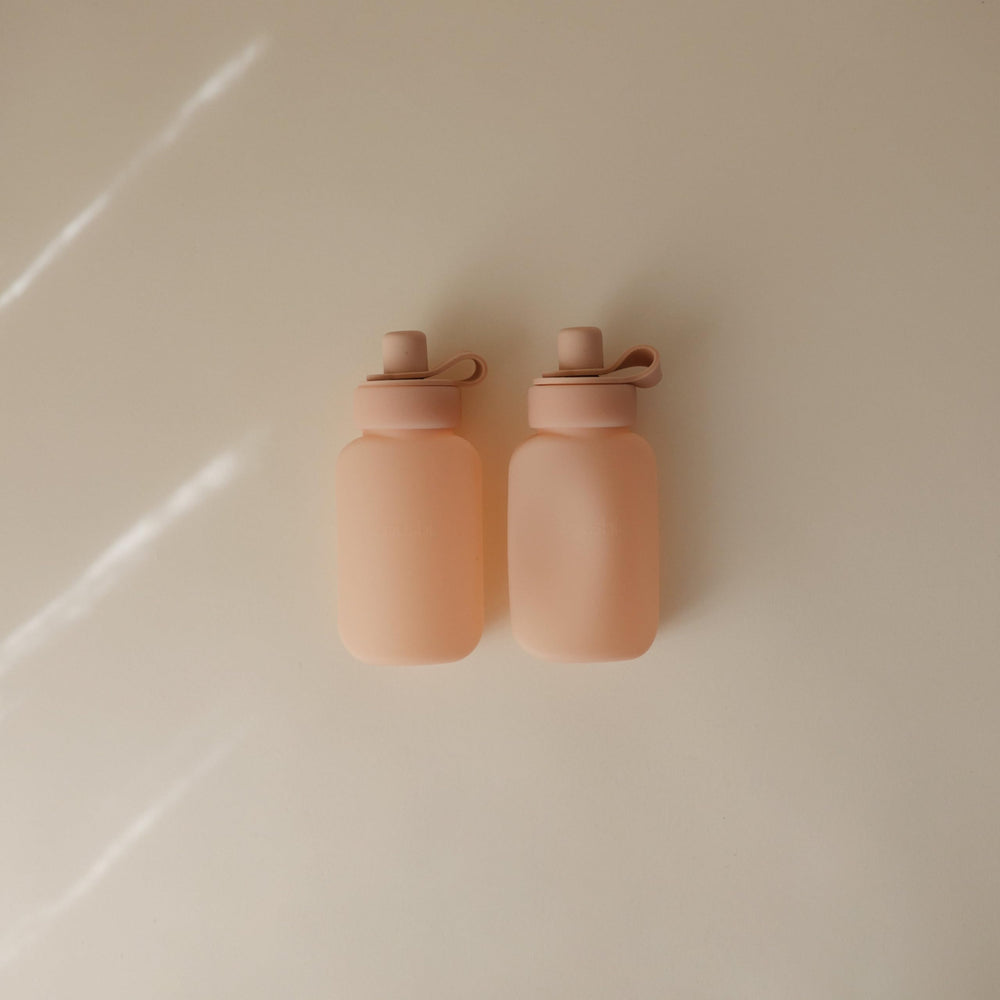 Mushie puree pouch filled, showing easy portion control for baby meals.