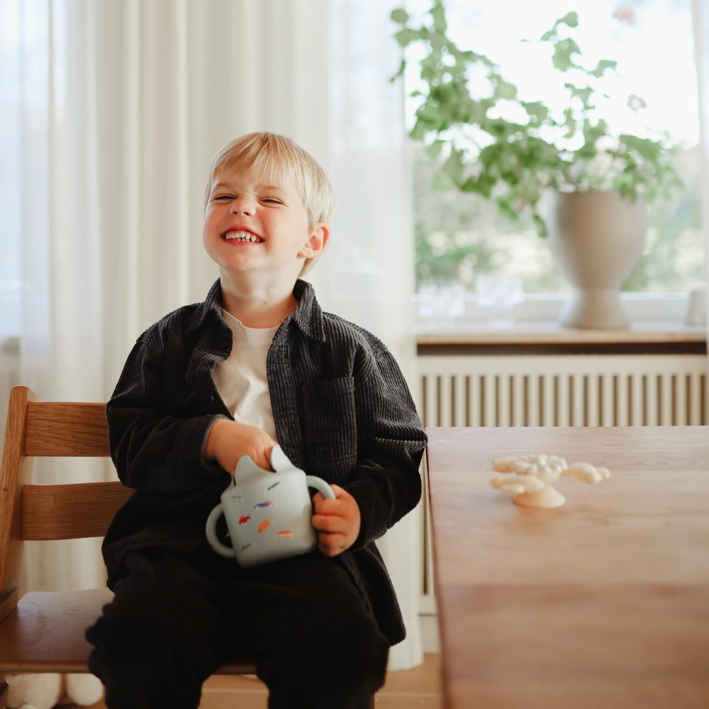 Mushie BPA-free snack cup ensures safe playtime snacks.