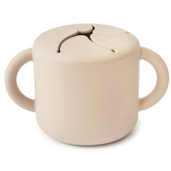 Mushie silicone snack cup with two handles for easy grip during self-feeding
