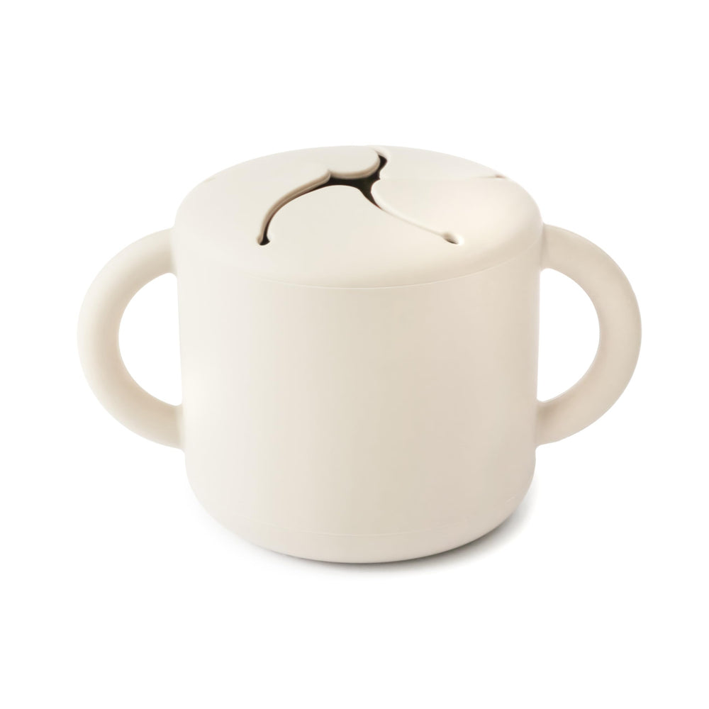 Mushie Silicone Snack Cup Ivory with two handles for easy toddler gripping during meals.