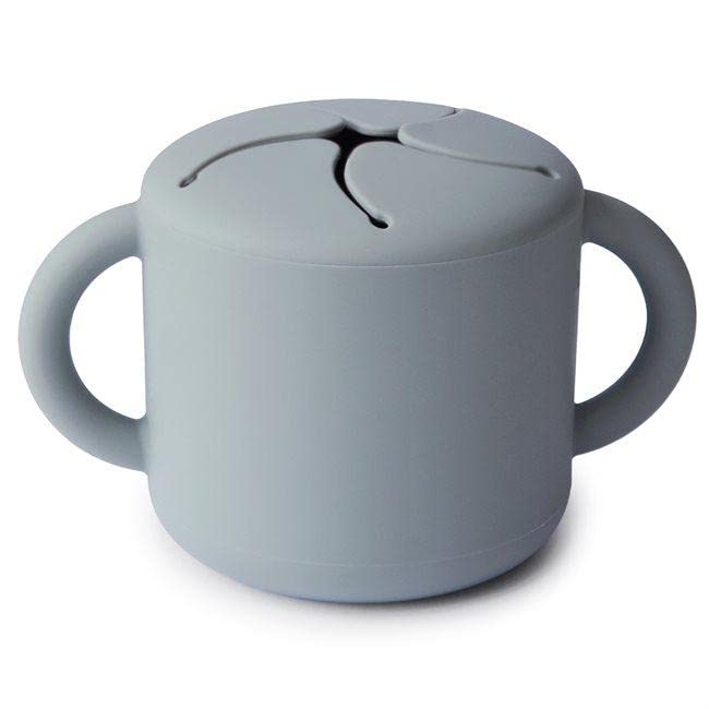 Mushie Silicone Snack Cup Stone child holding demonstrates secure grip during snack time