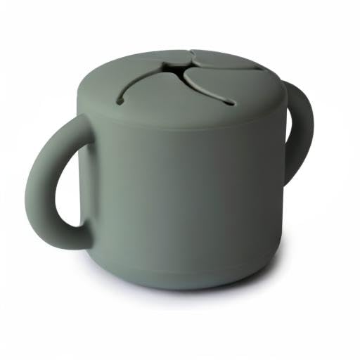 Mushie silicone snack cup supports secure grabbing during snack time