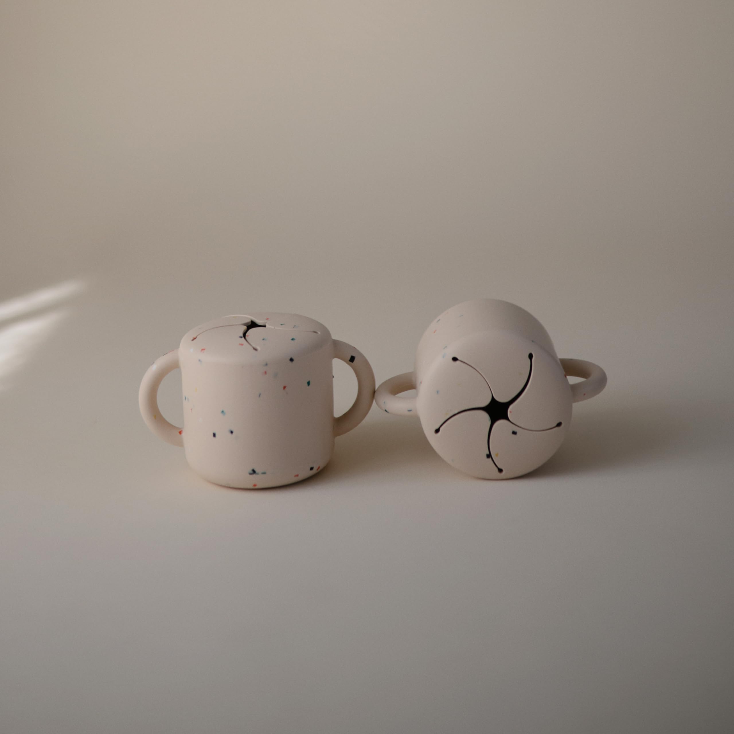 Mushie vanilla confetti color snack cup adds cheerful kitchen vibes.