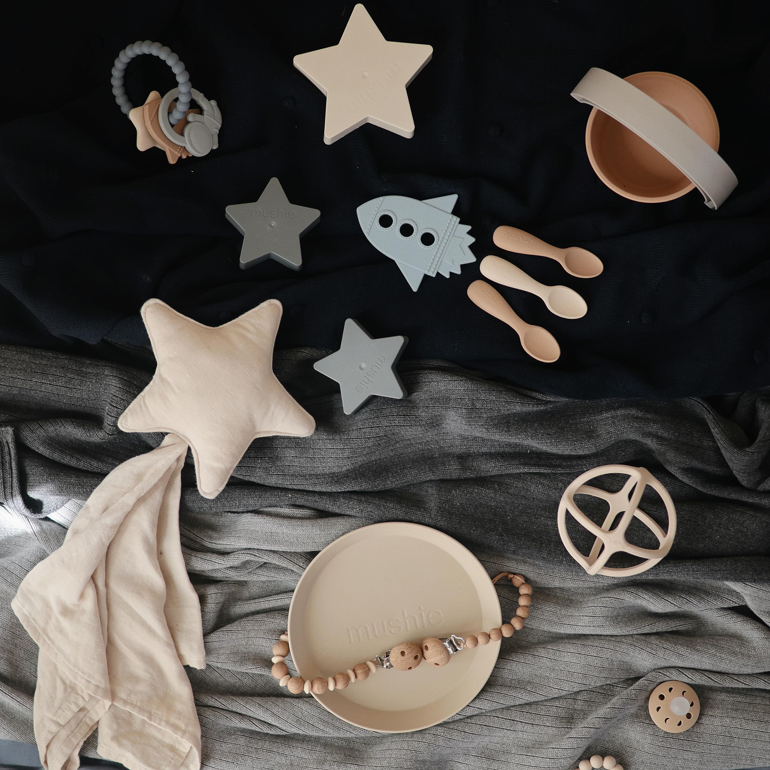 Mushie moon and star shapes invite visual stimulation and bite-friendly exploration.