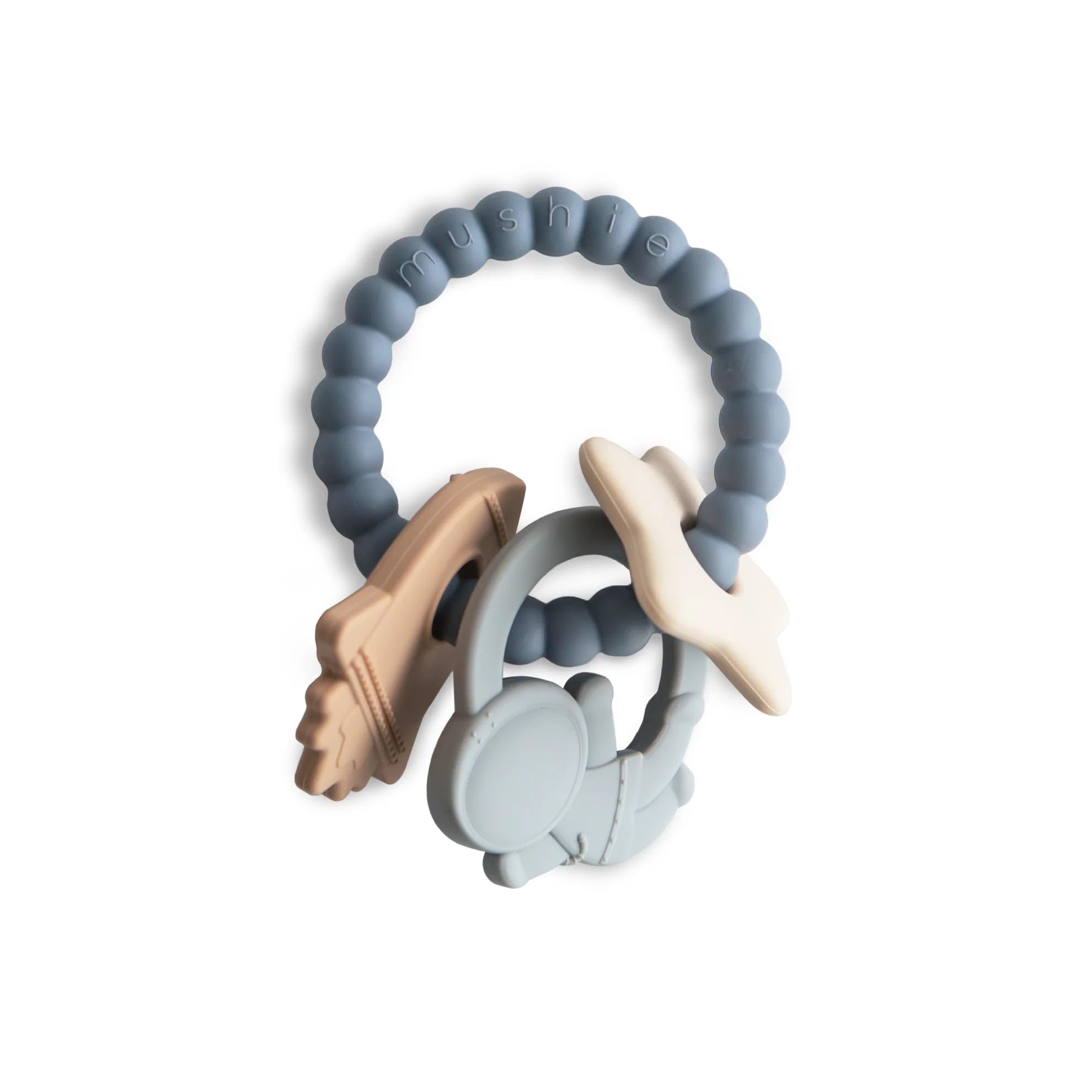 Mushie space teething ring closeup highlights easy-grip design for tiny hands.