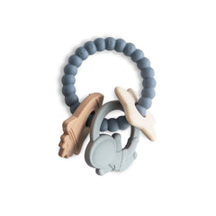 Mushie space teething ring closeup highlights easy-grip design for tiny hands.