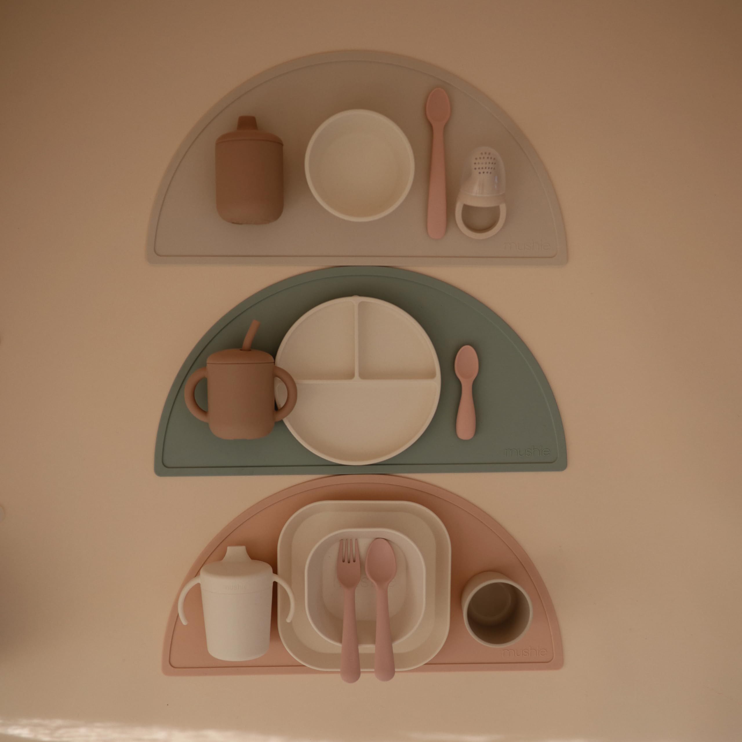 Mushie silicone suction plate ivory baby meal time highlights independent feeding potential.