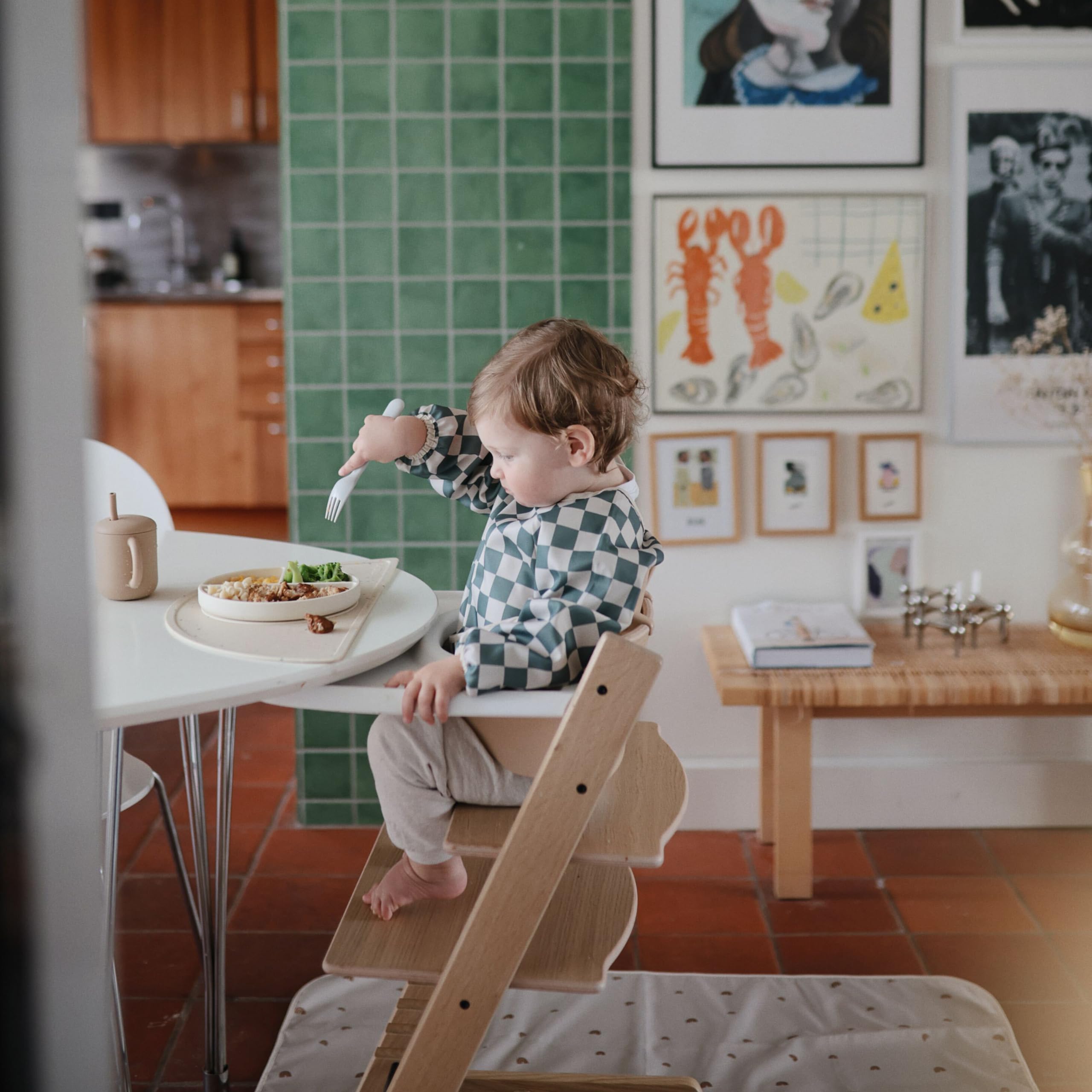 Mushie silicone suction plate ivory served on table illustrates spill-free mealtime.