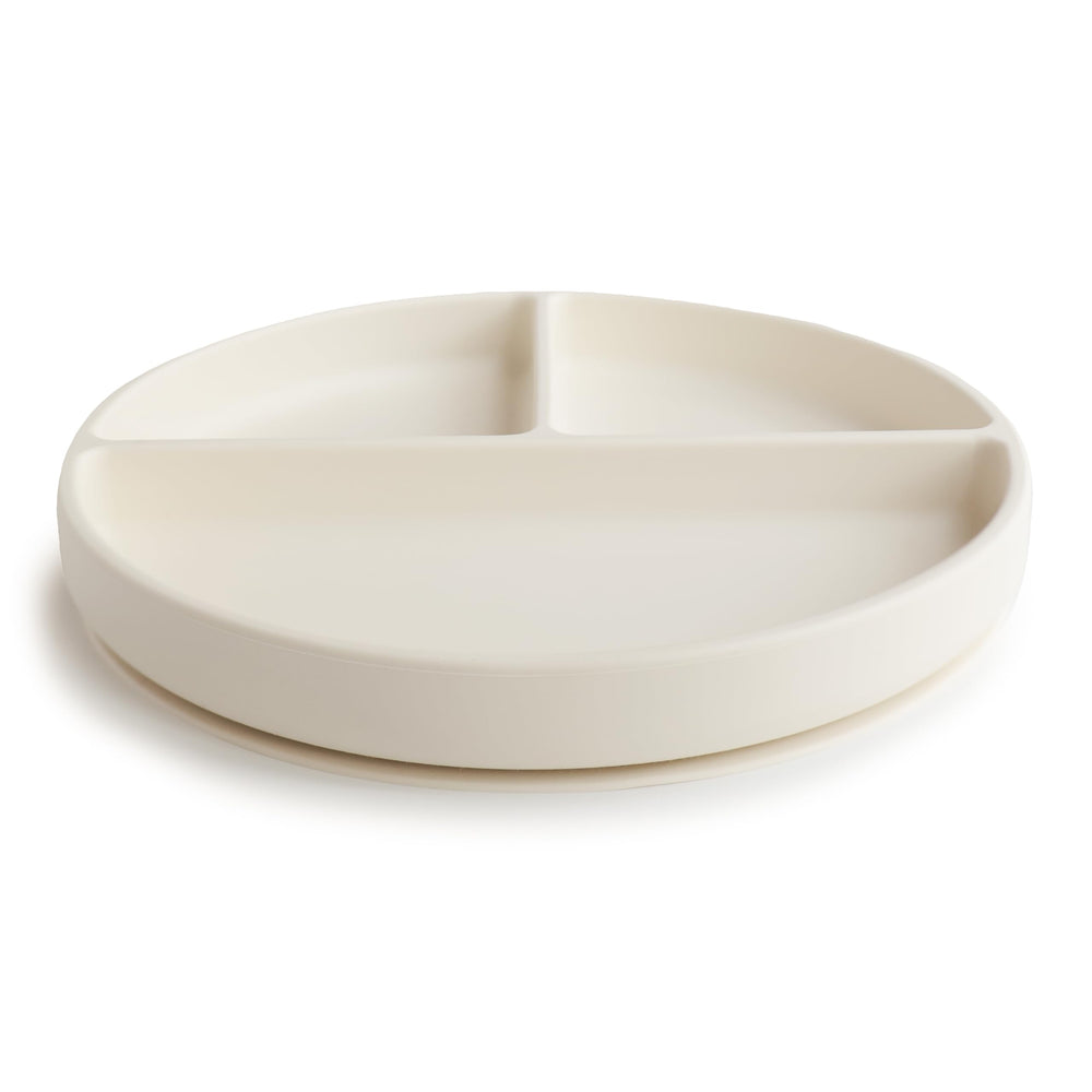 Mushie silicone suction plate ivory suction closeup shows safe, soft silicone for self-feeding.