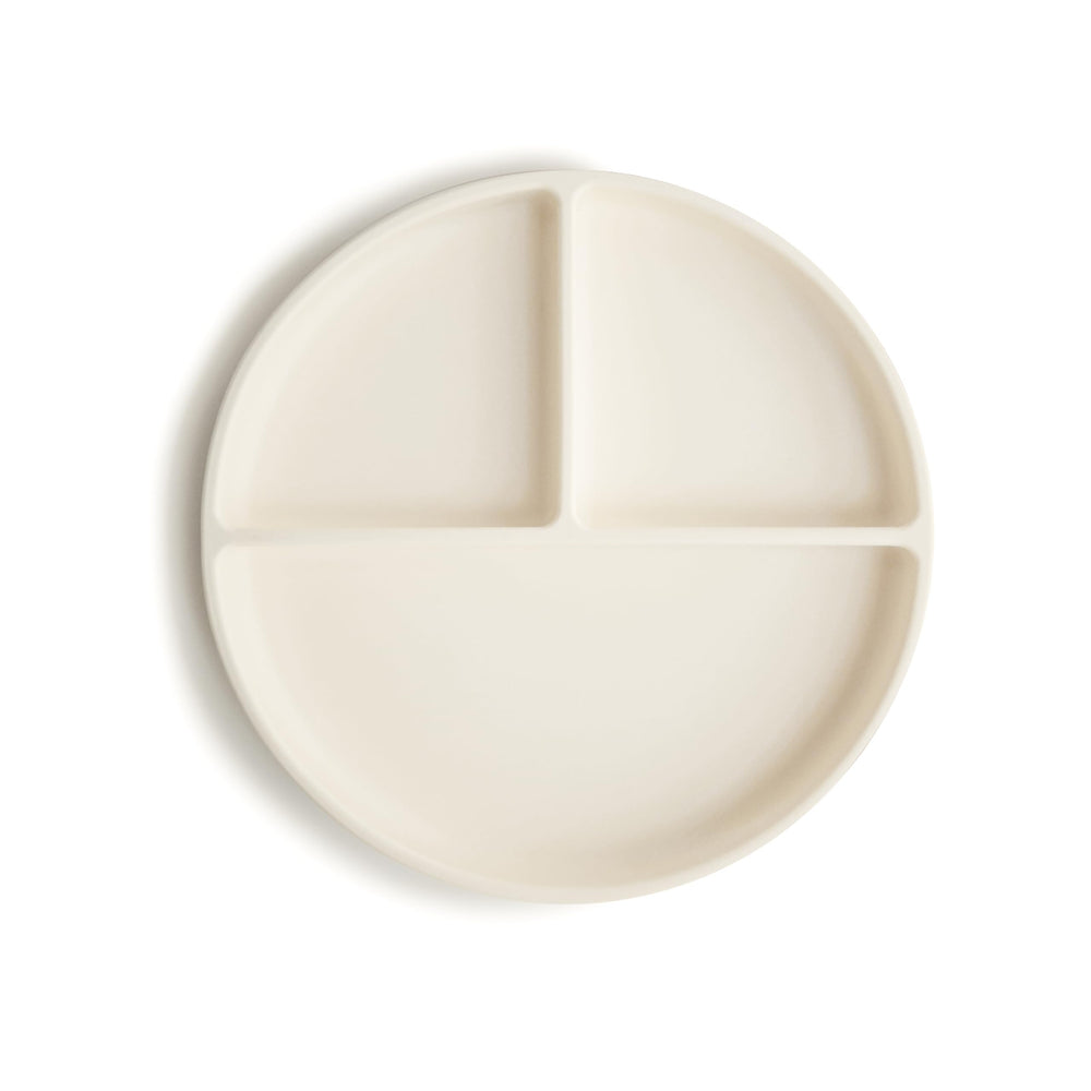Mushie silicone suction plate ivory top view shows non-slip base reducing spills.