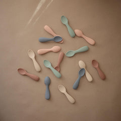 Mushie starter spoons natural hands demonstrating easy grip for self feeding
