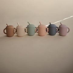 Mushie silicone toddler straw ready for gentle gums and easy sip.