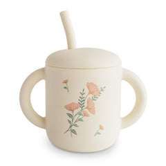 Mushie silicone training cup pink-flowers spill-free design for little hands and mess reduction.