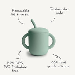 Mushie silicone training cup straw close-up highlights gentle straw for tender gums during transitions.