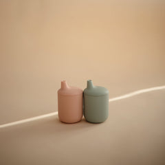 Mushie sippy cup Cambridge Blue lid shows leak-resistant design for travel.