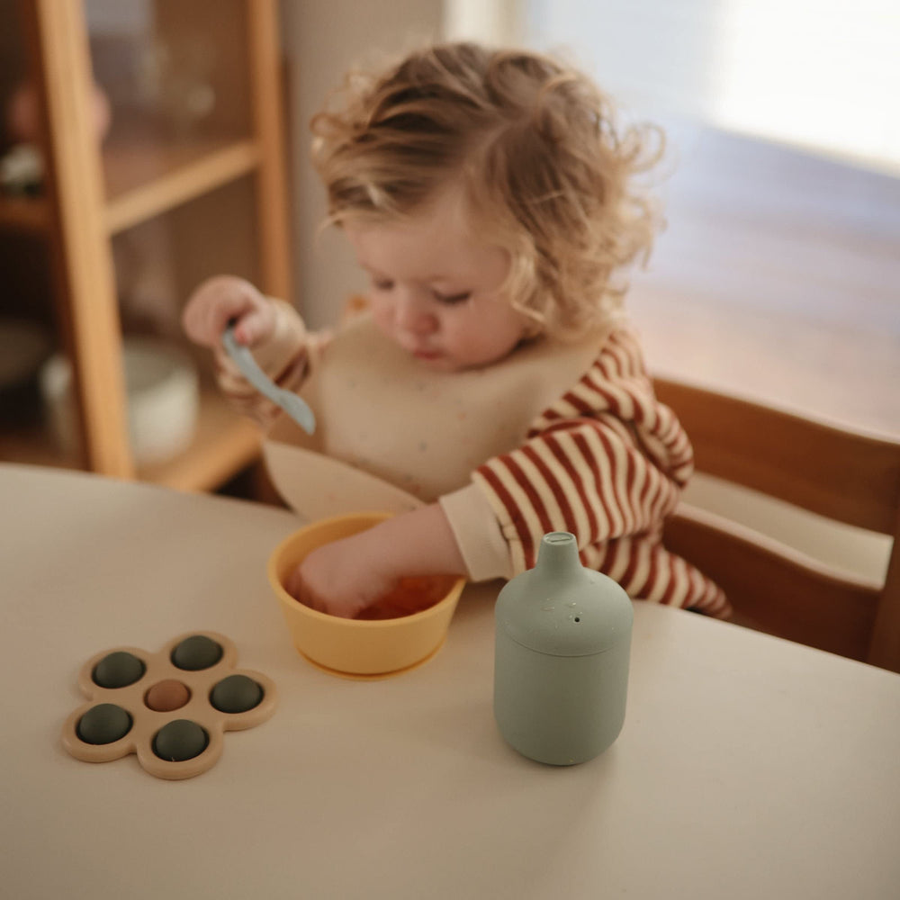 Mushie sippy cup leak-proof lid emphasises clean, worry-free refills.