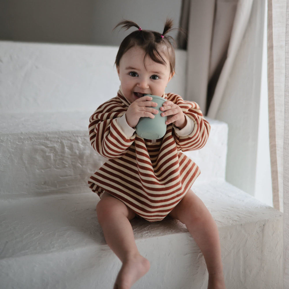 Mushie sippy cup silicone texture provides gentle gums during sipping.
