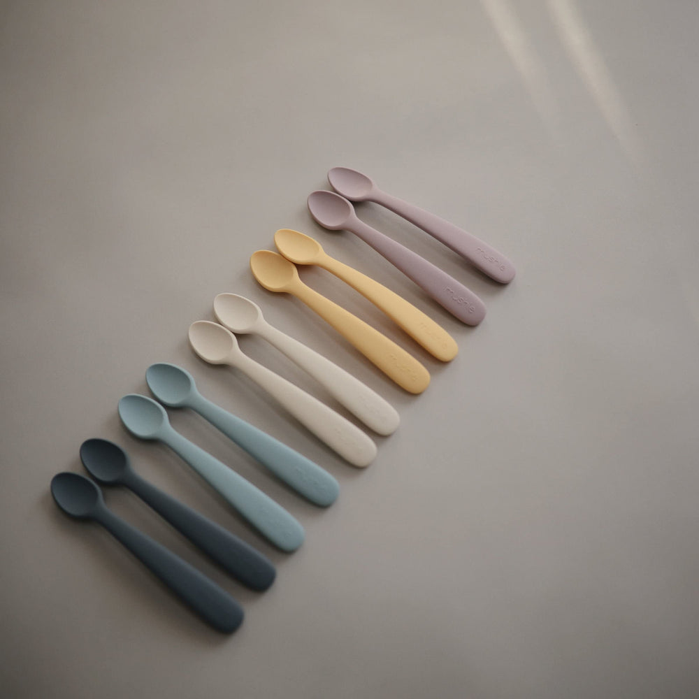 Solid food introduction with Mushie silicone spoon for safe feeding