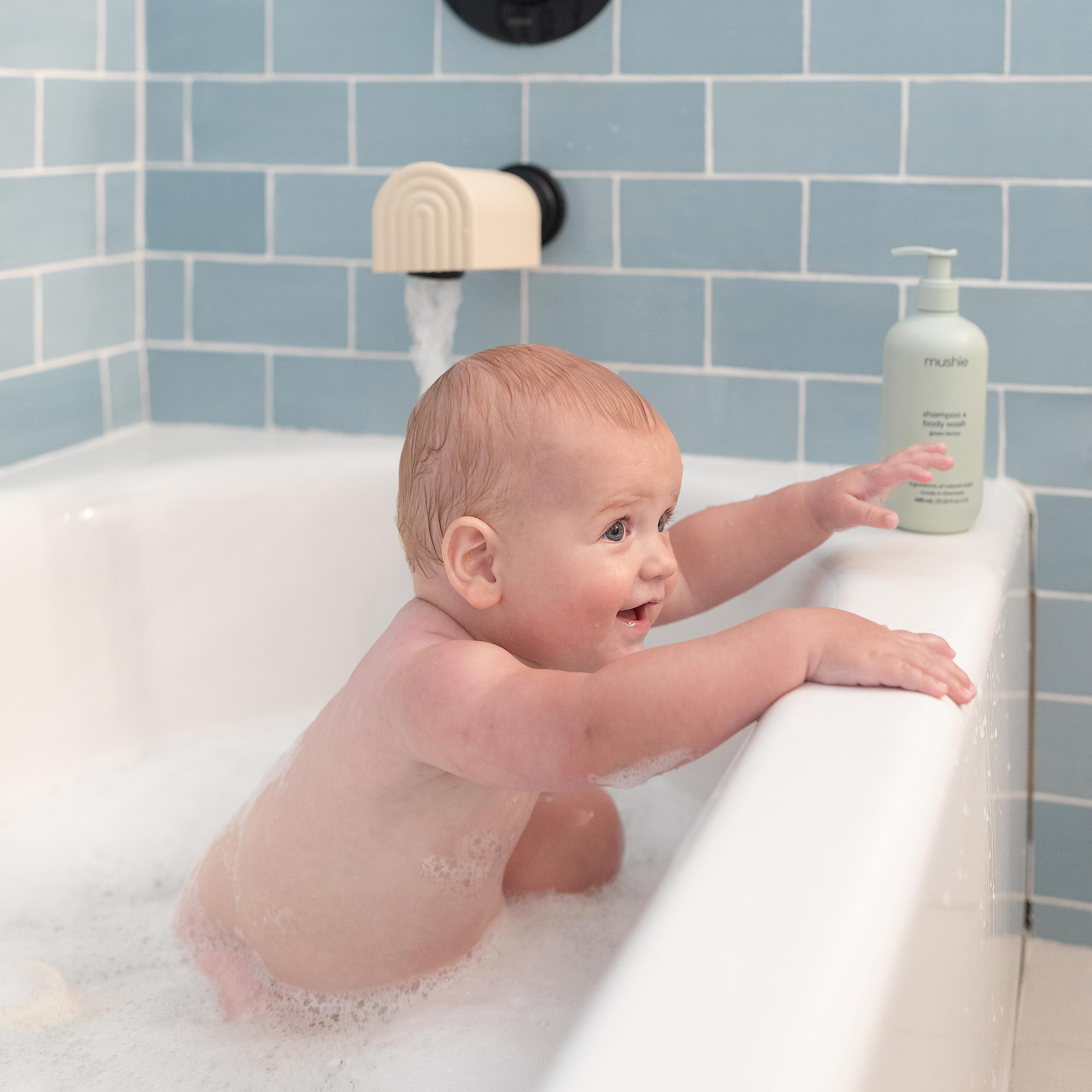 Mushie spout cover soft silicone cushions protruding faucet areas for gentle contact