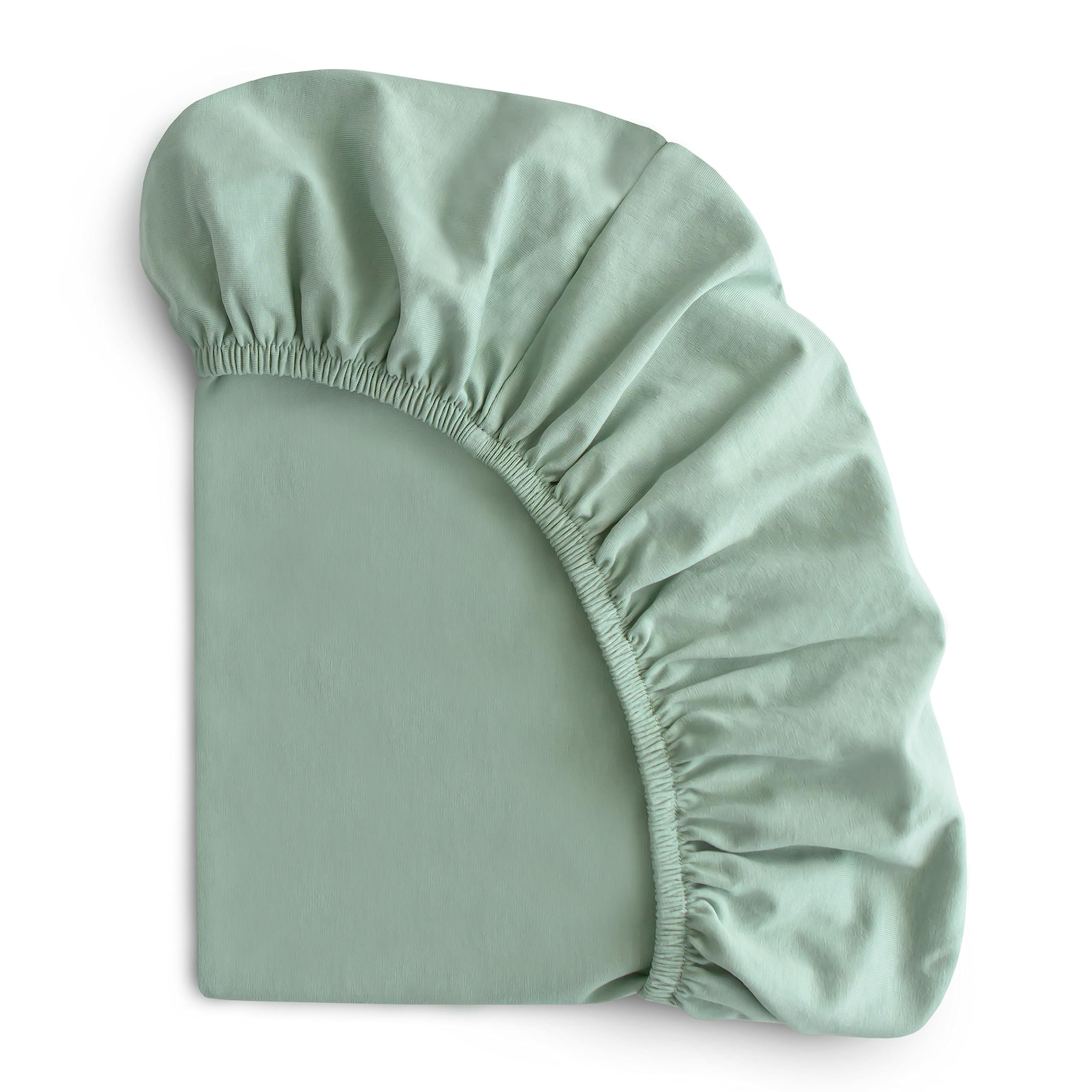 Mushie Stretchy Bassinet Sheet Roman Green on bassinet mattress for secure fit