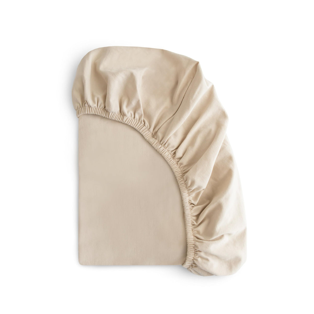 Mushie stretchy mini crib sheet fog folded for easy storage