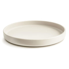 Mushie suction plate on dry surface demonstrates strong suction during feeding.