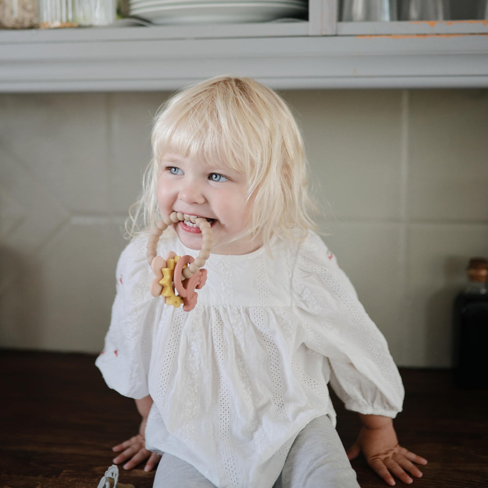 Mushie Teething Ring 8x12 cm size shown for easy grip