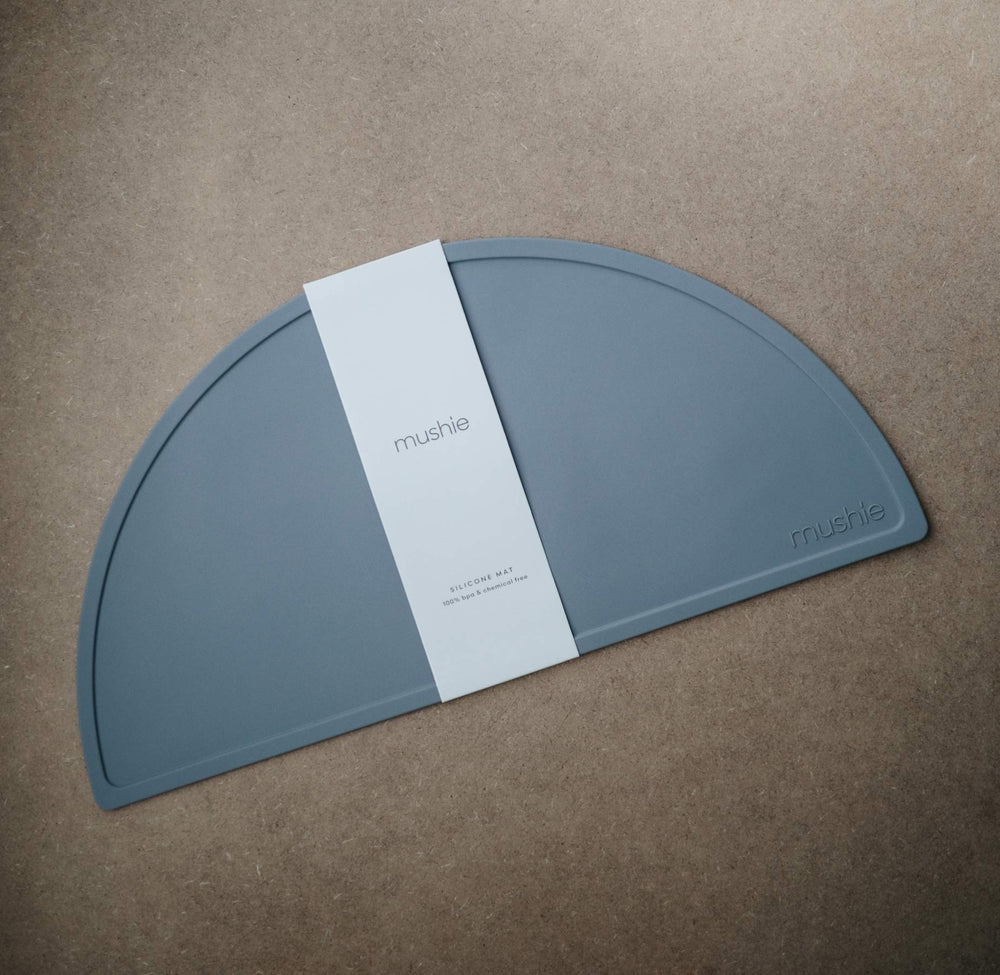 Mushie Tradewinds non-slip placemat close-up shows stable mealtime surface.