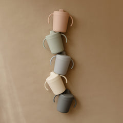 Mushie Trainer Sippy Cup Ivory on-the-go hydration for busy days.