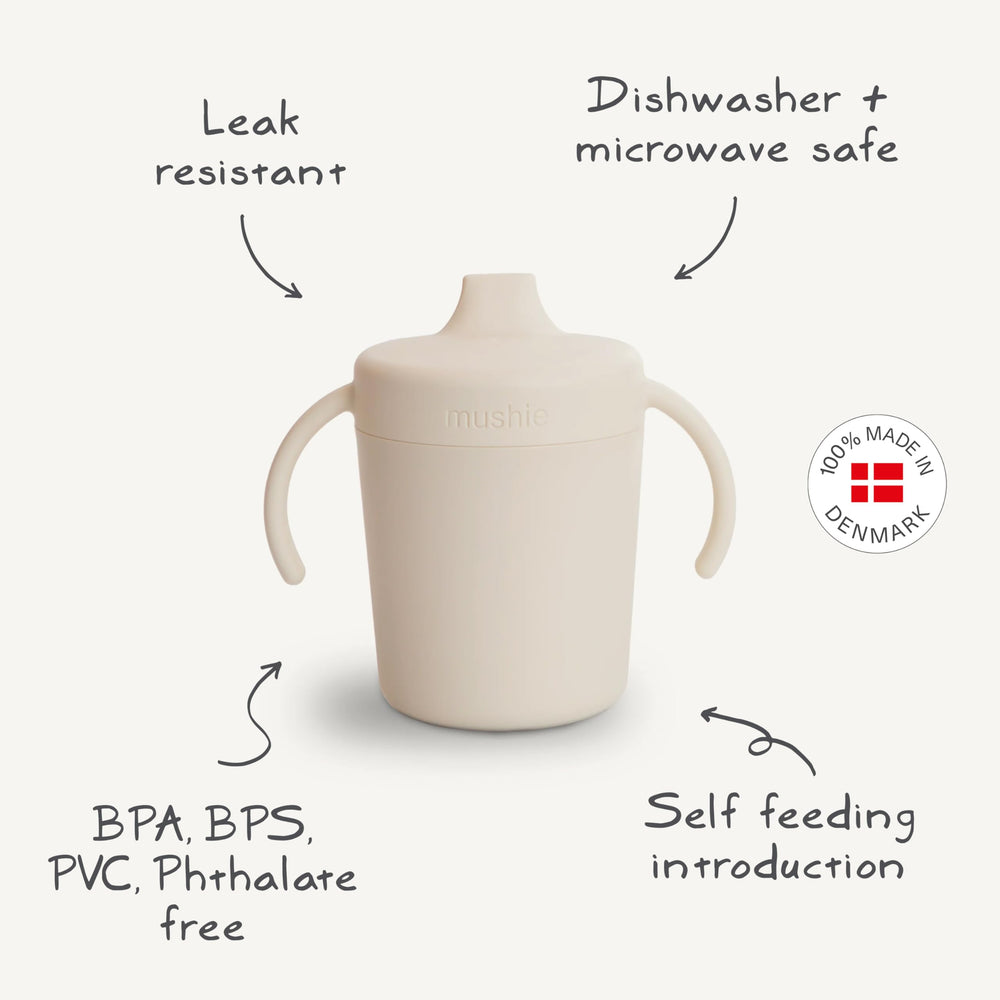 Mushie Trainer Sippy Cup sage leak-resistance demonstrated for travel