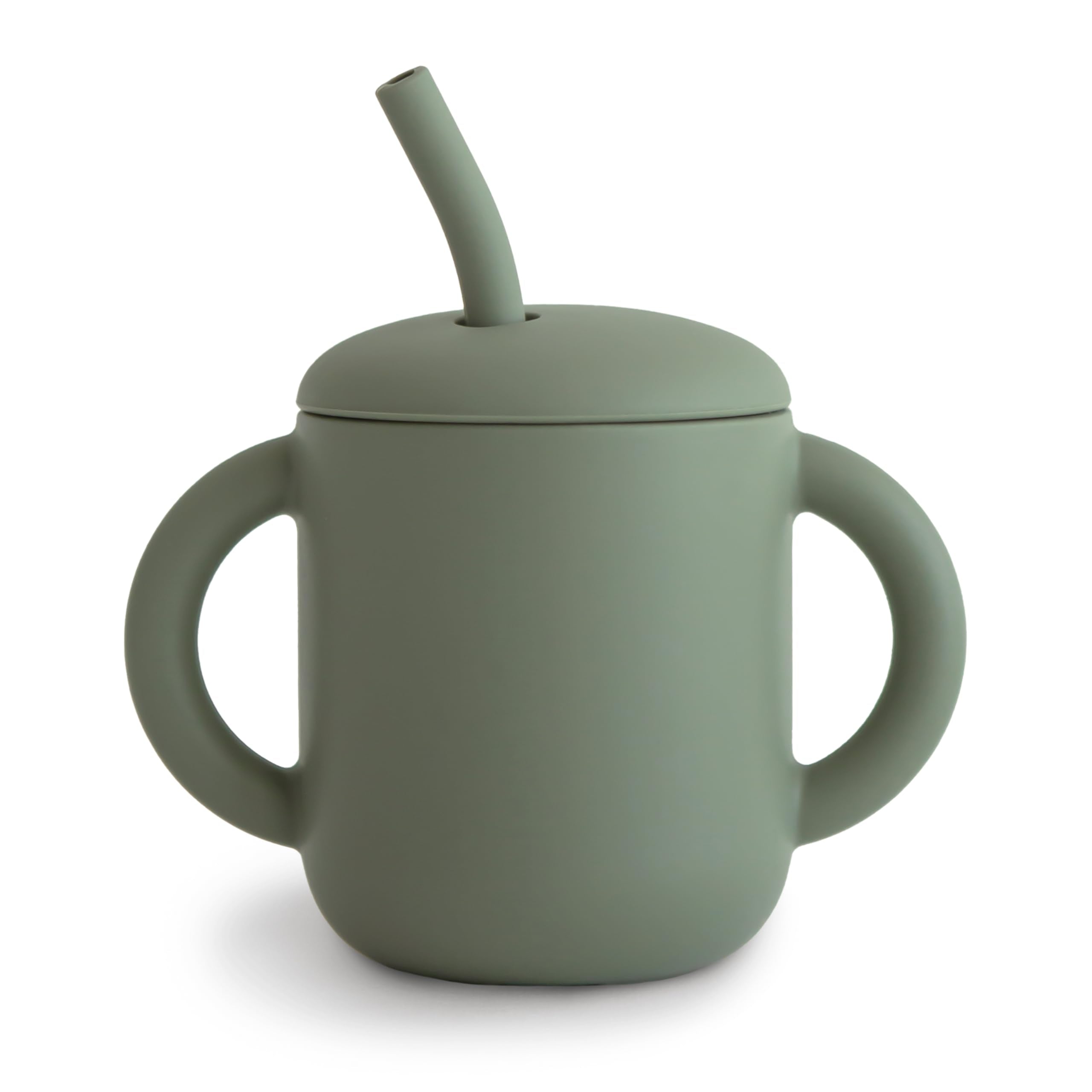 Mushie training cup with lid on, spill-proof design for mess-free meals.