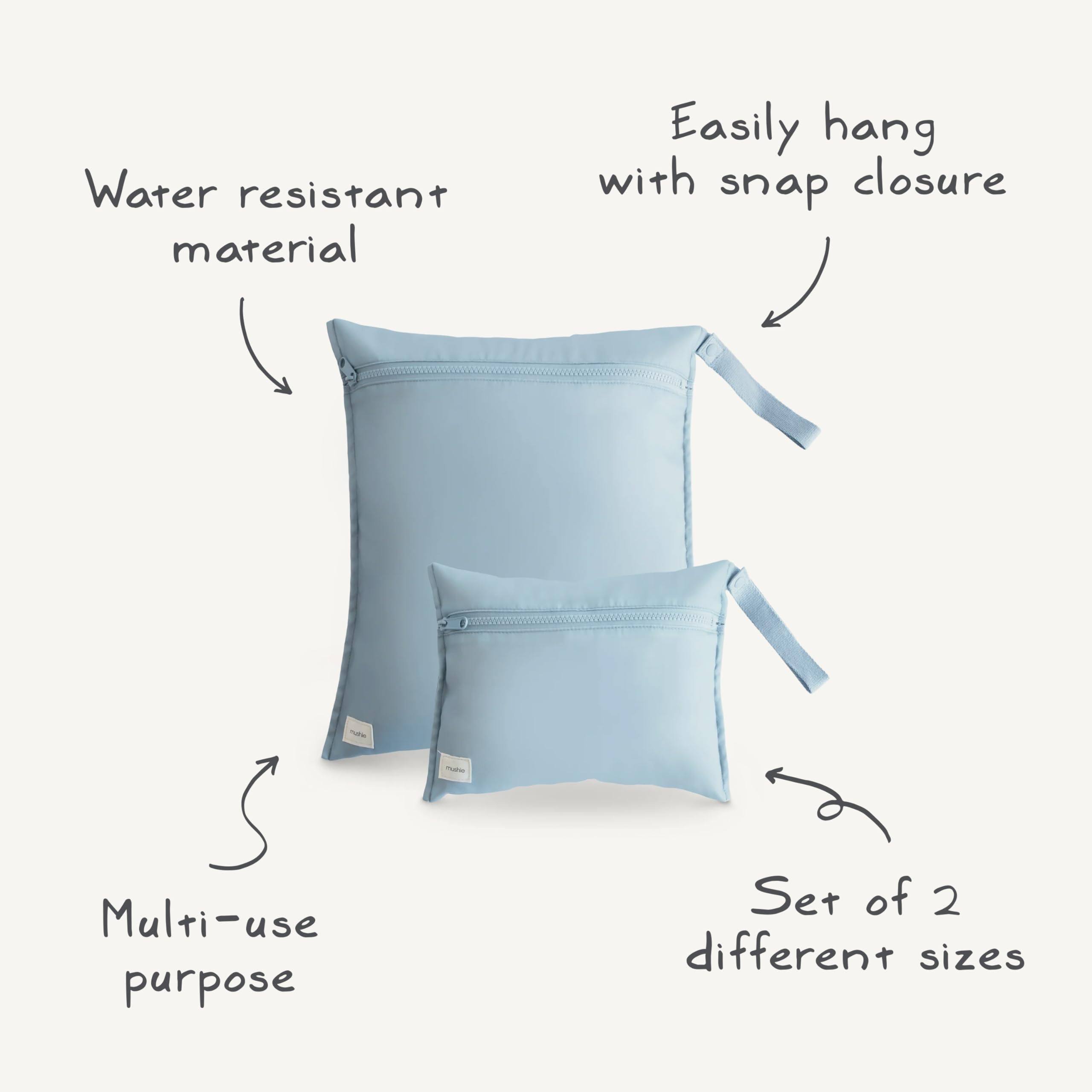 Mushie rainbow wet bag travel set folds neatly in a diaper bag.