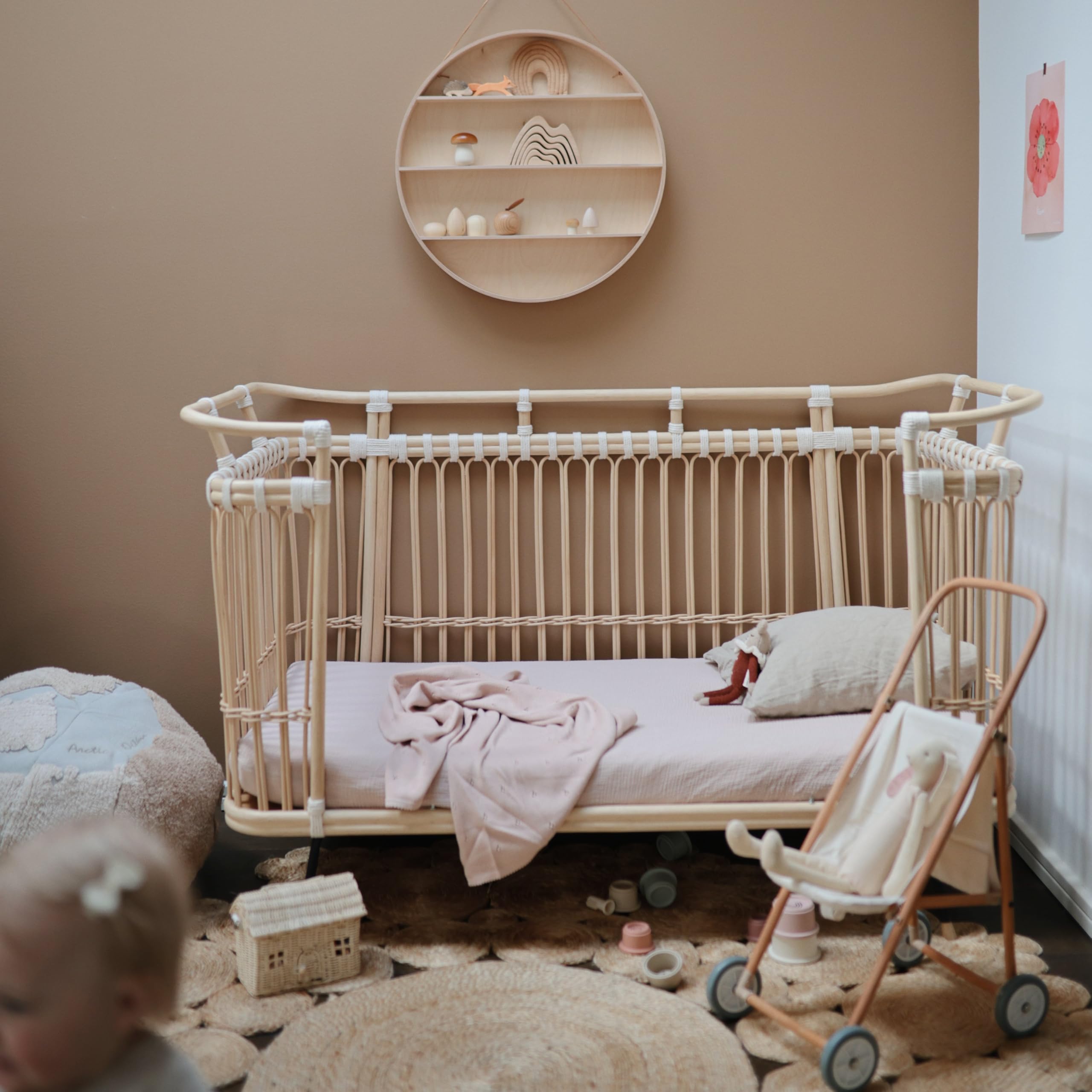 Mushie blush and fog sheets match many nursery decors.