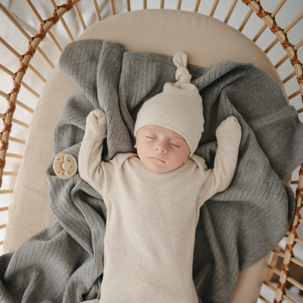 Mushie two-pack crib sheets simplify changing and laundry.