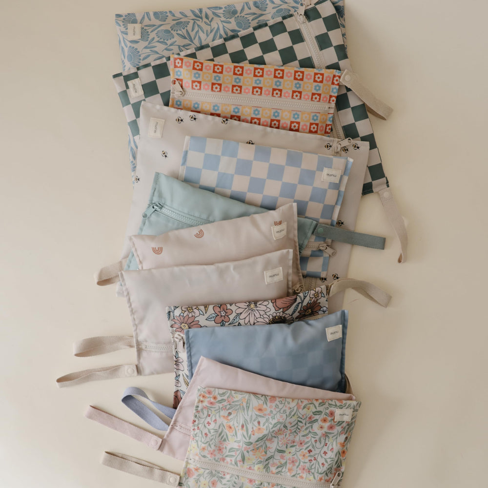 Mushie 2-pack wet bags provide convenient sizes for diaper and school bags.
