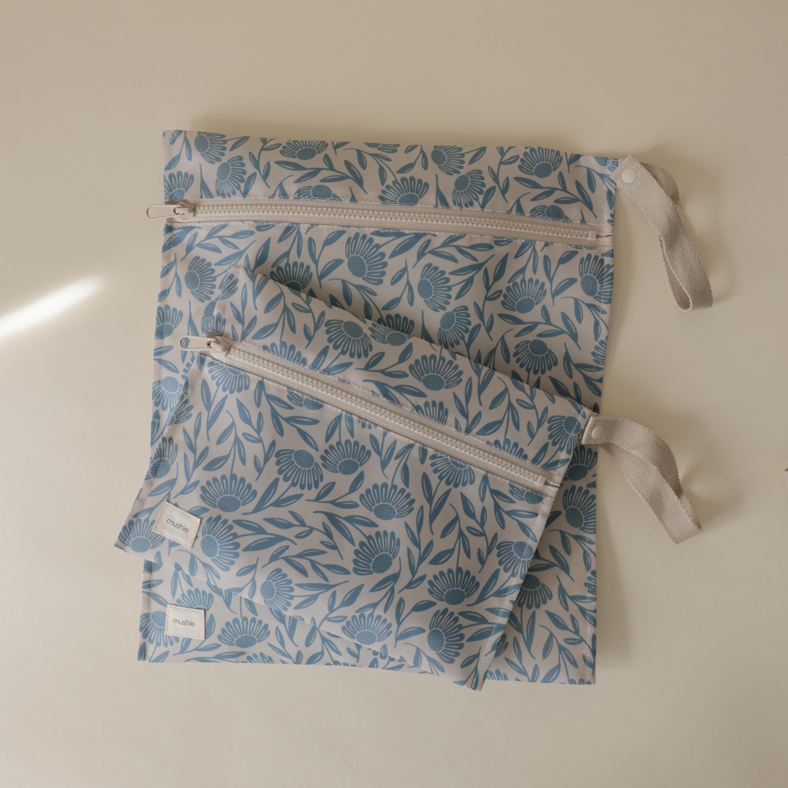 Mushie wet bags with snap handle for stroller or bag attachment