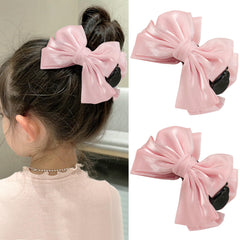 MWRDSM pink bow hair claw clip securing a ponytail with a non-slip grip.