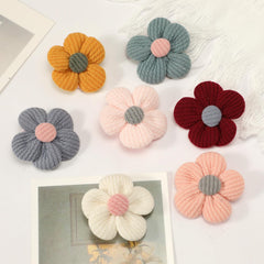 MWRDSM pink flower hair clip worn on a smiling toddler for photos.