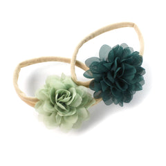 My Lello baby headbands set in light sage and hunter green with soft floral petals.